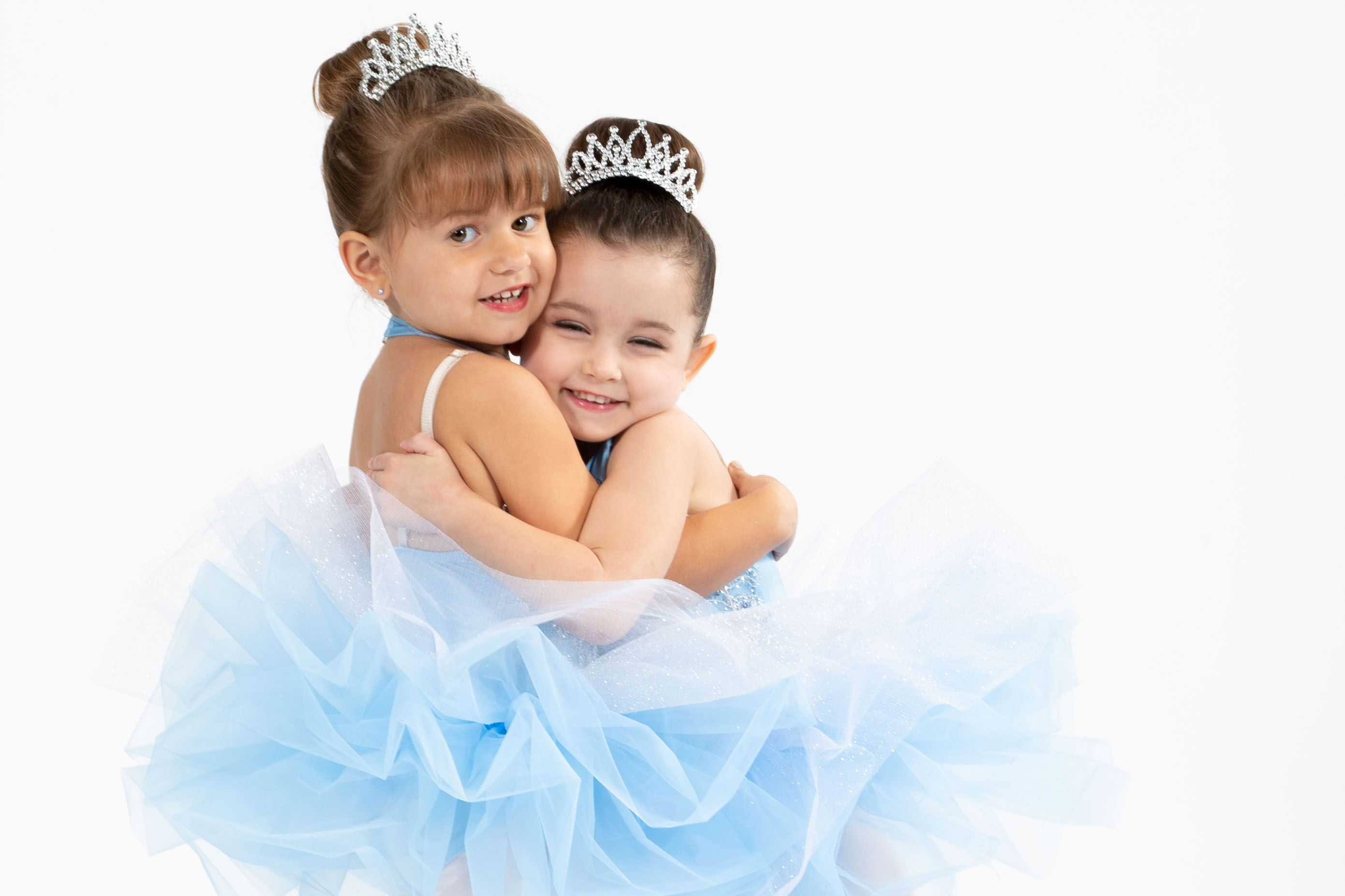 two baby dancers hugging